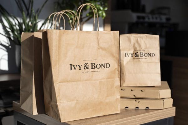 The IVY & BOND Logo Design on Takeaway Bags