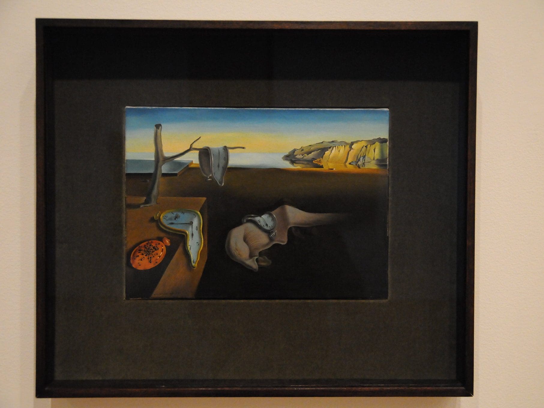 The Persistence of Memory by Salvador Dalí with a frame minimal in style.